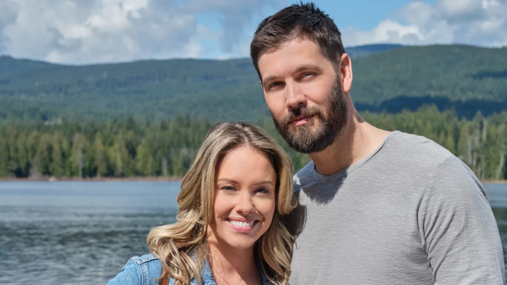 Casey Deidrick with Stephanie Bennett smiling standing by riverside.