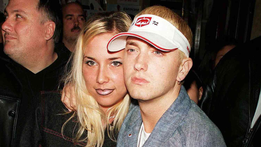 The image shows Eminem with her ex-wife Kimberly Ann Scott.